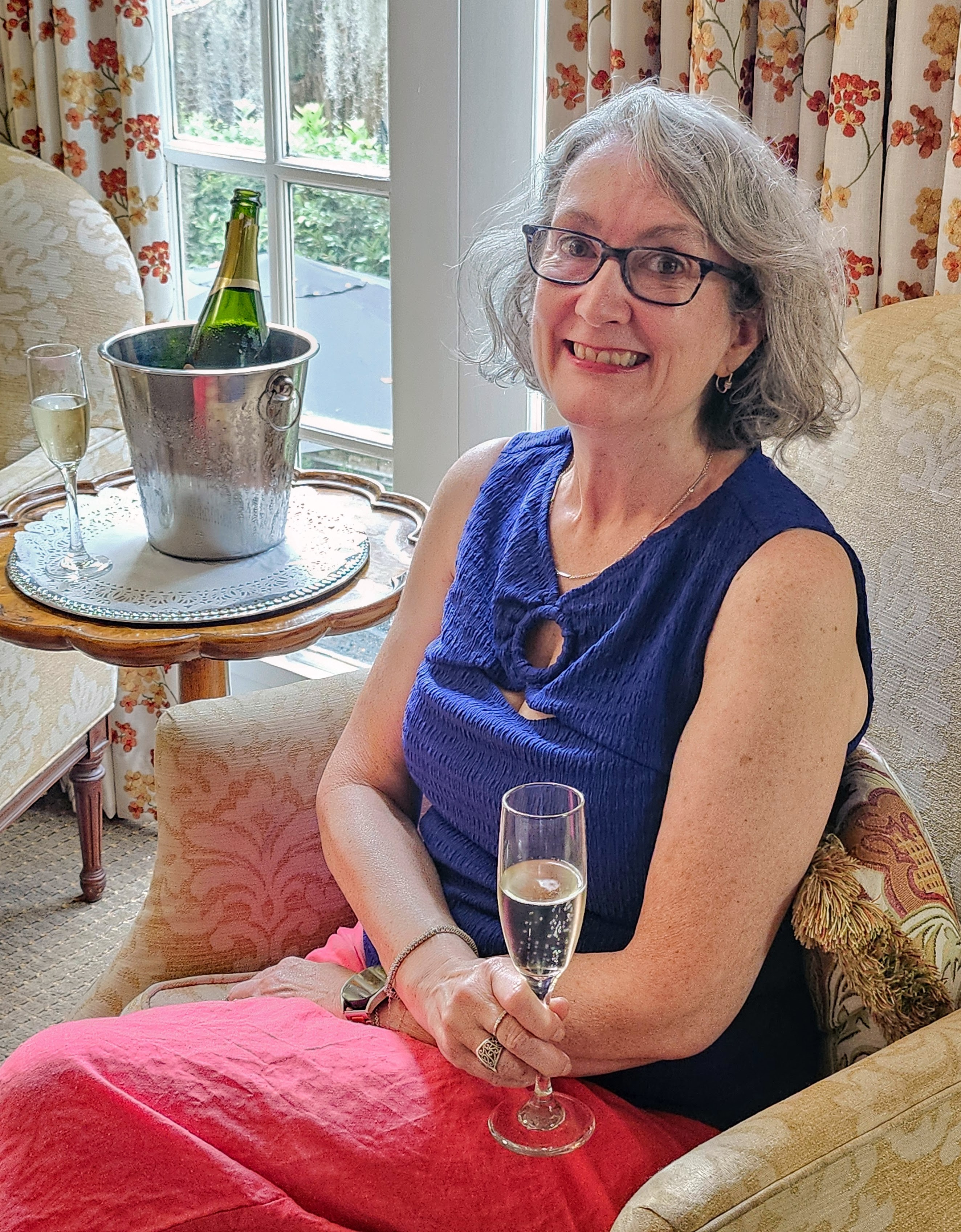 Heather McKechney raising a glass during a presentation